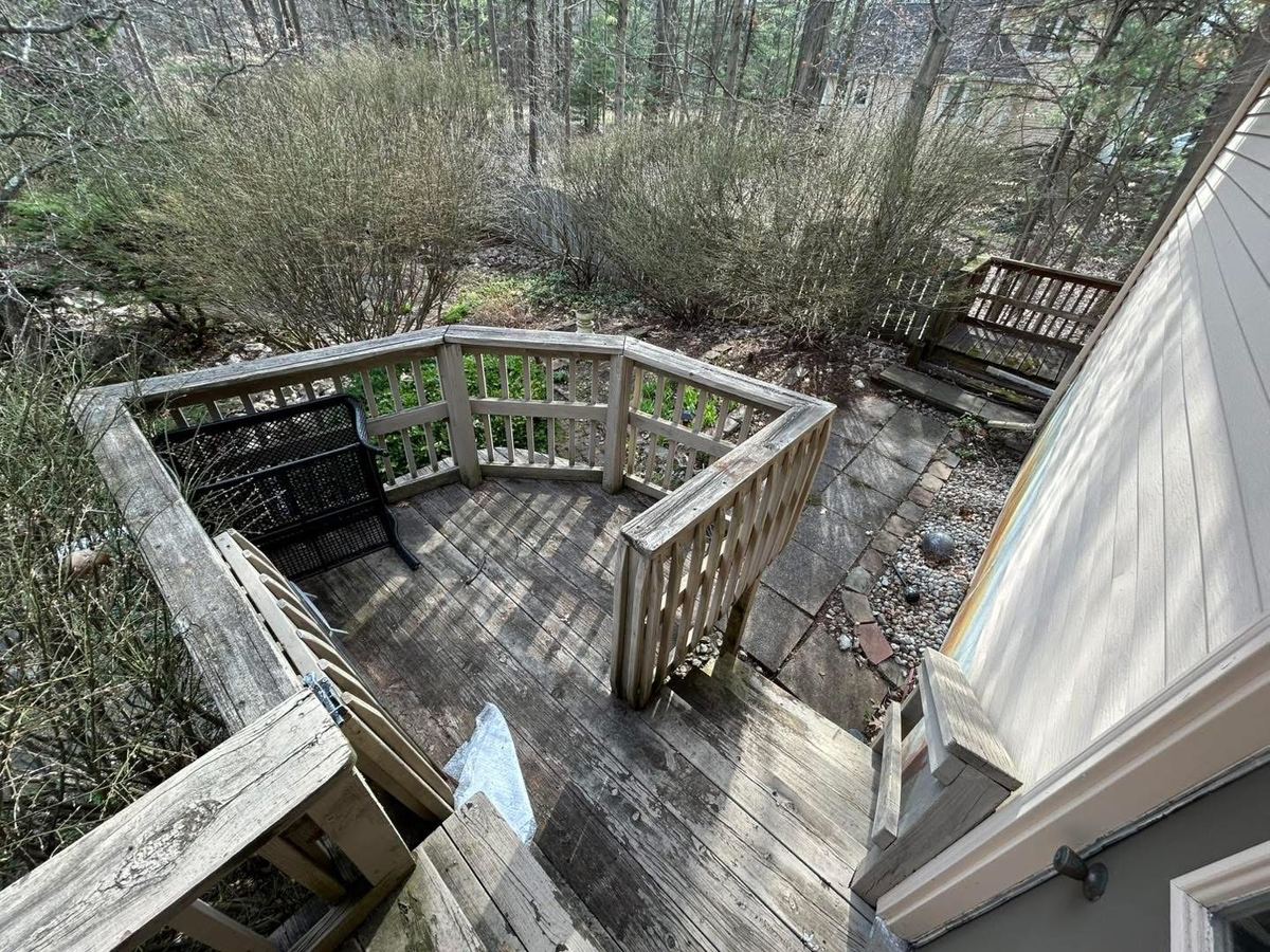 After — curved deck and stone retaining wall cleared