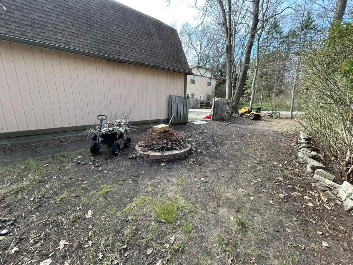 After — backyard fire-pit area cleared and tidied
